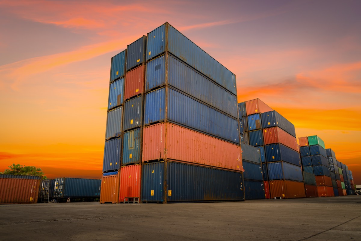 Cargo ship at port at dusk representing international freight